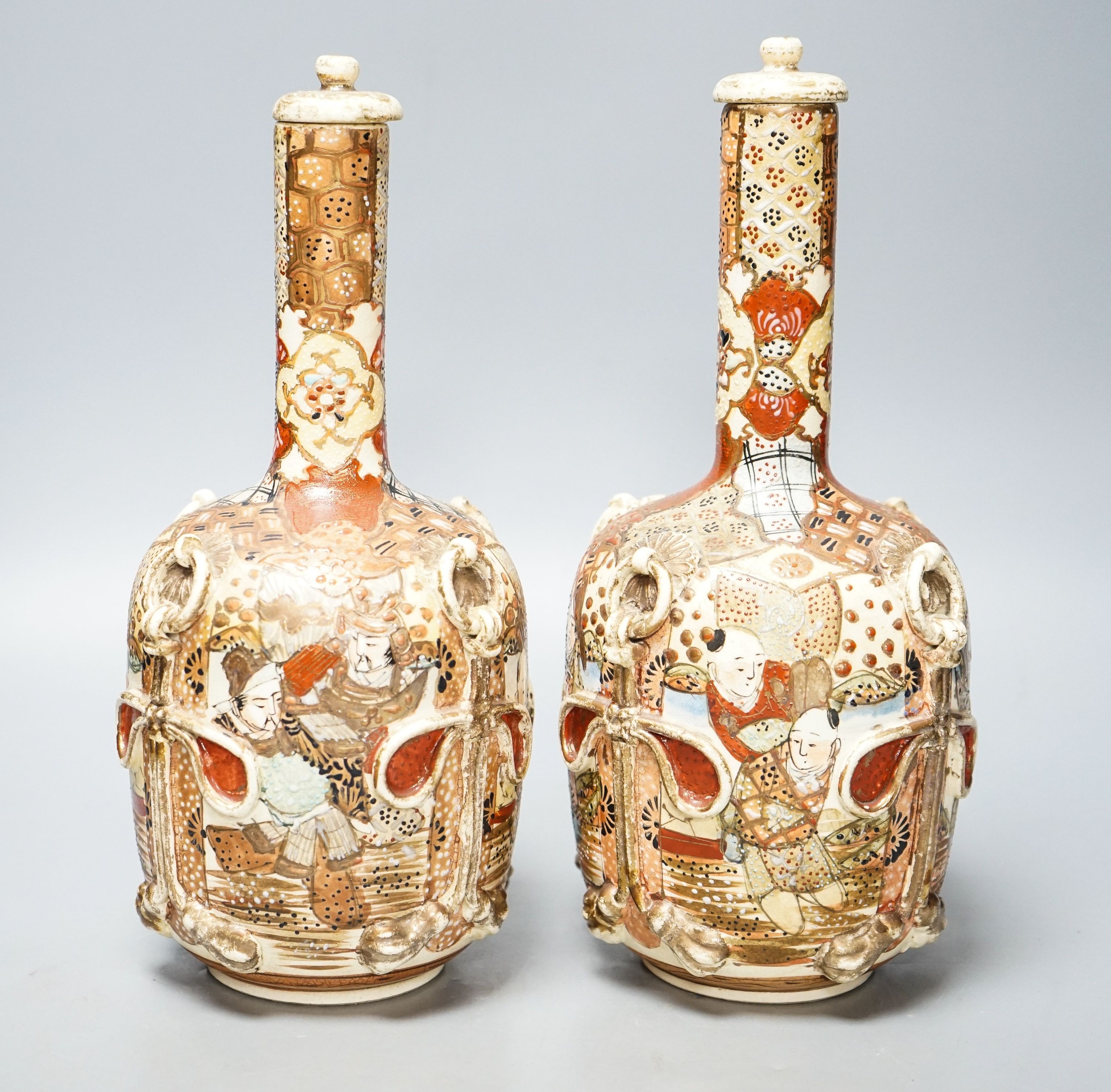 A pair of Japanese Satsuma pottery lidded bottle vases 27cm